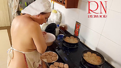 Nudist housewife Regina Noir cooks at the kitchen. Naked maid. Naked housewife. s3