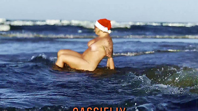 Santa Claus was walking on the beach and received a gift of milk on her face... Watch the full video on Cassiflix