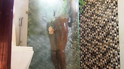 Hot Ebony Milf tries her new toy in shower and gets caught