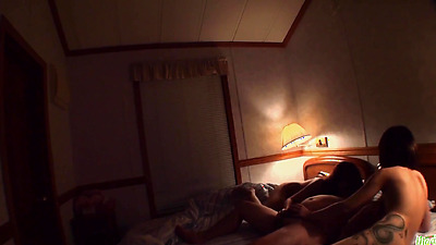 Brunette Asian chick is fed loads of cum by a chubby guy in a 3some