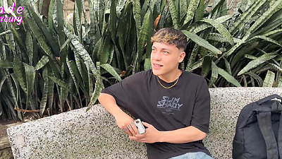 Recruiting a boy near the metro station in Medellin Colombia