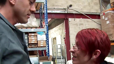 French redhead mature business lady Katy Morlait catches her employee wanking huge dick in the warehouse then sucks him off and fucks him