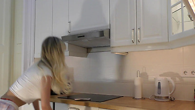 Super hot big tits beautiful sexy latina in the kitchen prepares coffee with a backless kitchen apron