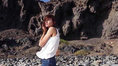 Skinny all natural Russian cutie Taya Vais relaxing naked at the beach