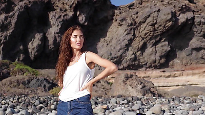 Skinny all natural Russian cutie Taya Vais relaxing naked at the beach