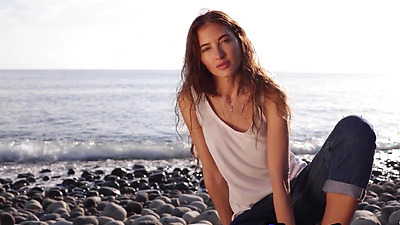 Skinny all natural Russian cutie Taya Vais relaxing naked at the beach