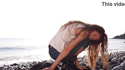 Skinny all natural Russian cutie Taya Vais relaxing naked at the beach