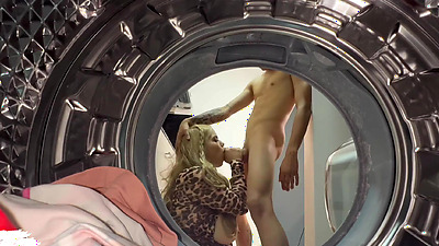 Chubby blonde has sex with a young guy in the laundry room