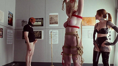 Bondage puppet gets spun around for rough anal and ATM