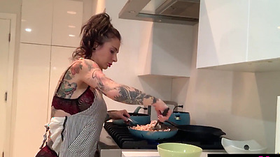 Inked MILF housewife Joanna Angel cooking and dildoing her hungry pussy