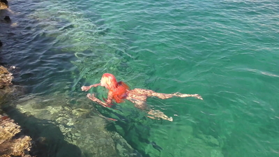 Blue water and a naked babe!