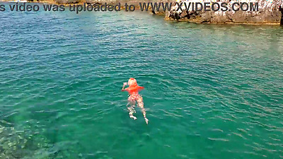 Blue water and a naked babe!