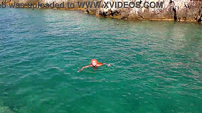 Blue water and a naked babe!