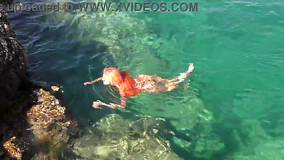 Blue water and a naked babe!