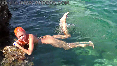 Blue water and a naked babe!