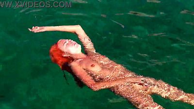 Blue water and a naked babe!