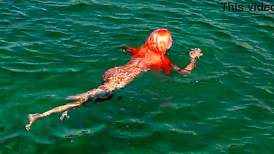 Blue water and a naked babe!