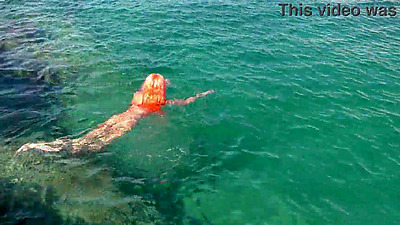 Blue water and a naked babe!