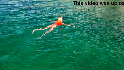 Blue water and a naked babe!