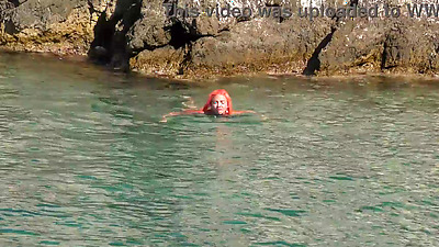 Blue water and a naked babe!