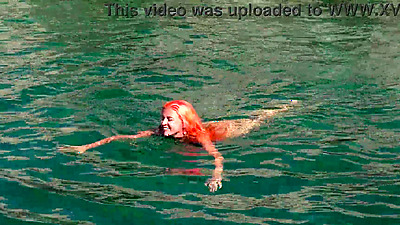 Blue water and a naked babe!