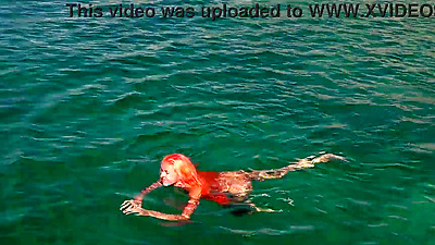 Blue water and a naked babe!