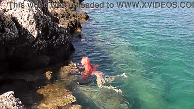 Blue water and a naked babe!