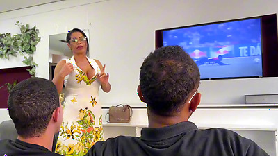 A disgruntled MILF forces two guys to turn off the TV so they can fuck her arse.