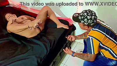 An old prostitute seducing her client in a bar private room. She shakes her big tits and masturbates her wet pussy for the lucky stranger. Would you fuck her?