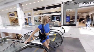 Horny blonde masturbates in the Mall