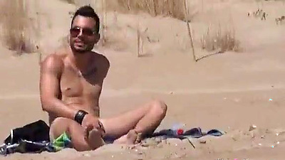 Sol fucks a guy in a beach surrounded by voyeurs