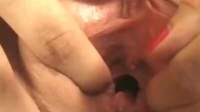 Sexy brunette hair stands over the camera and shows her taut bawdy cleft