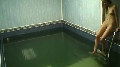 Frisky chick rubbing pussy in the pool!