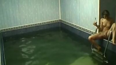 Frisky chick rubbing pussy in the pool!