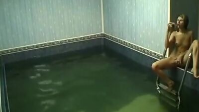 Frisky chick rubbing pussy in the pool!