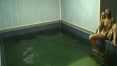 Frisky chick rubbing pussy in the pool!