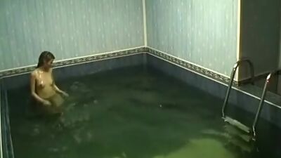 Frisky chick rubbing pussy in the pool!