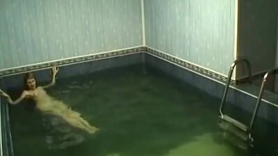 Frisky chick rubbing pussy in the pool!