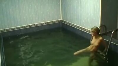 Frisky chick rubbing pussy in the pool!