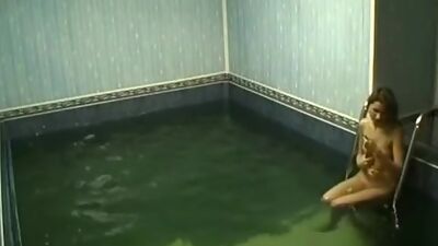 Frisky chick rubbing pussy in the pool!