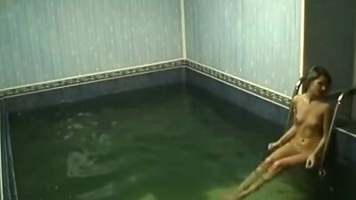 Frisky chick rubbing pussy in the pool!