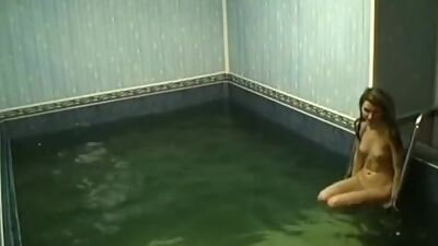 Frisky chick rubbing pussy in the pool!