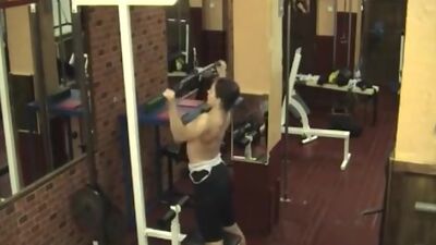 Sexy brunette stripping in the gym!