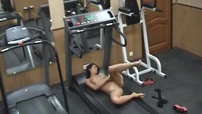 Lustful brunette playing wild in the gym!