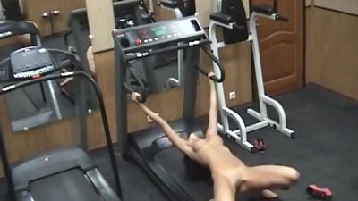 Lustful brunette playing wild in the gym!