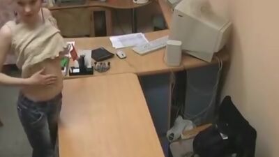 Blonde babe masturbating on the office table!