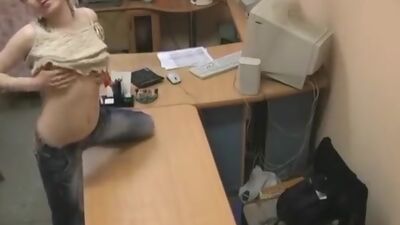 Blonde babe masturbating on the office table!