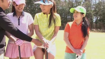 Cute Asian teen girls play a game of strip golf
