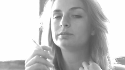 Busty Ashlee Graham smokes while showing off her natural tits