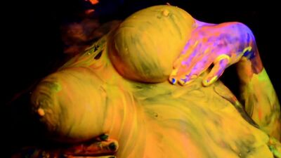 Busty Natasha Shoots A Fun And Sexy Black Light video